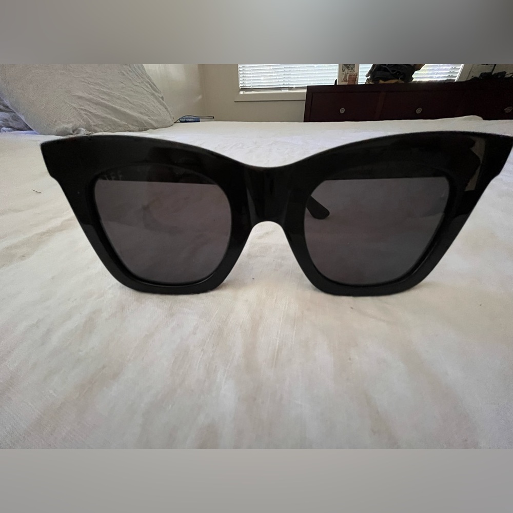 Diff glasses. Glossy black with black lenses.  Case included.